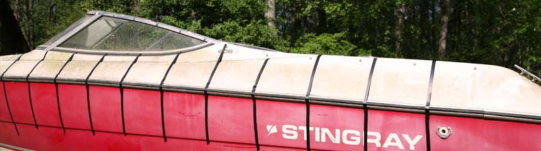 A red stingray powerboat is sectioned off by tape in preparation for the test.