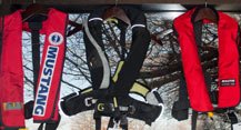 three inflatable life jackets at the ready three inflatable life jackets at the ready