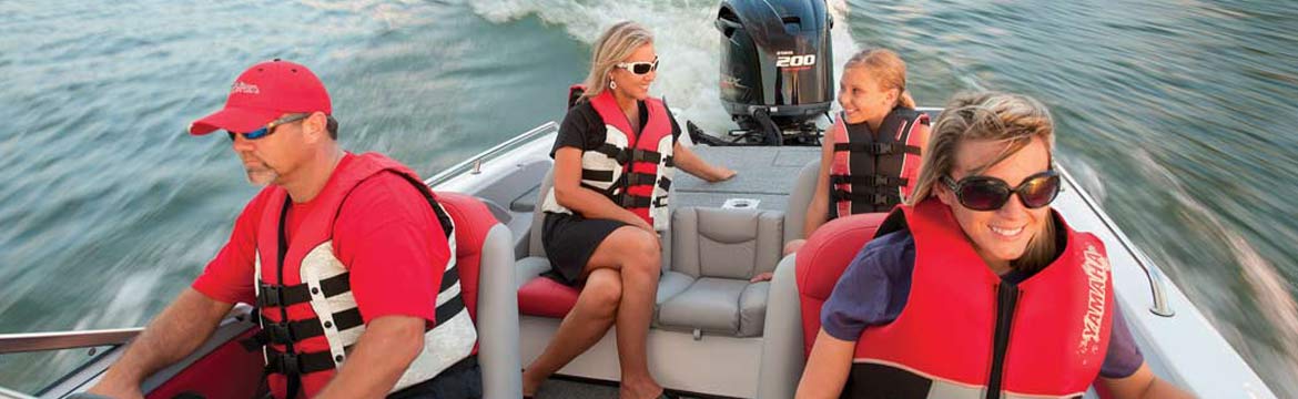 a group of people wearing life jackets on a boat
